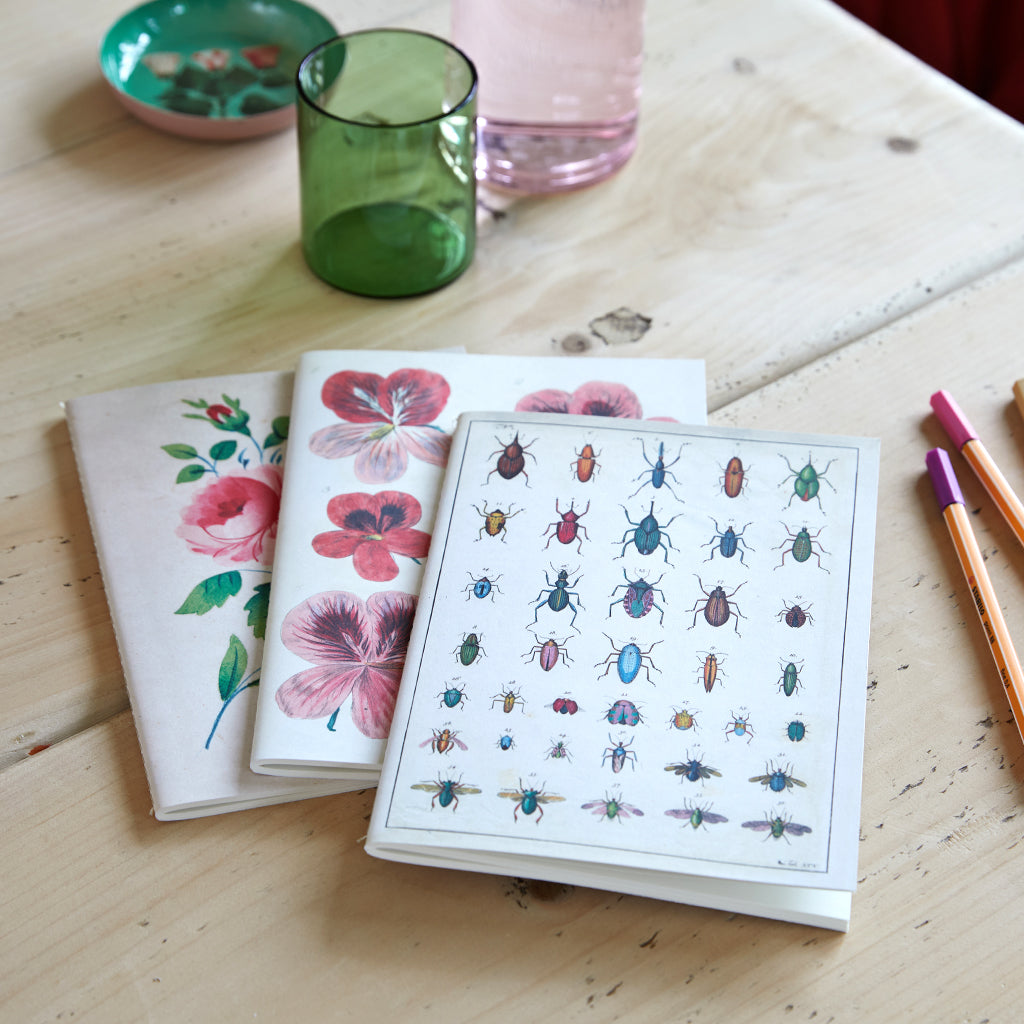 Set of three notebooks in the garden